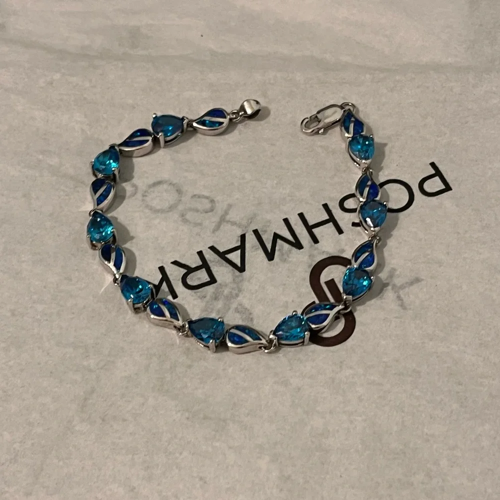 LOVED AUTHENTIC LONDON BLUE TOPAZ STONES/BLUE FIRE OPAL STERLING SILVER BRACELET